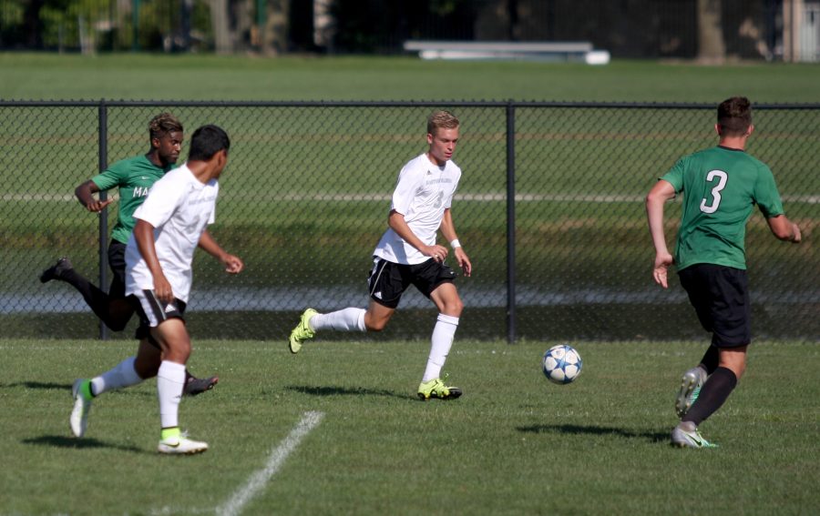 Sophomore defender Jacob Lysik moves the ball upfield during the Panthers game against Marshall University on Sept. 4, 2016. The Panthers lost, 1-0.