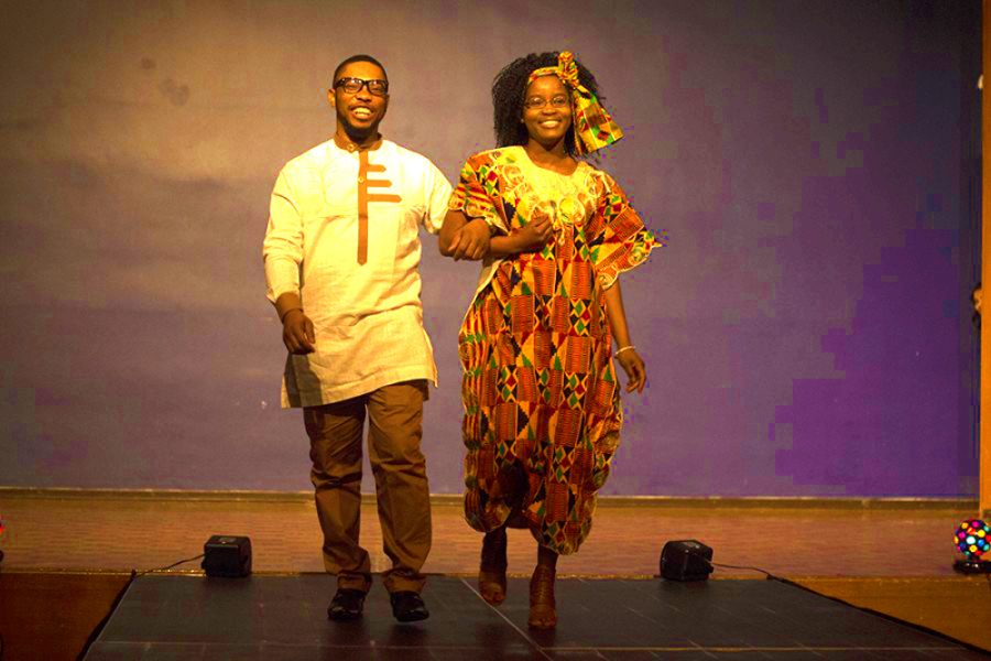 Ernest Echefu, a graduate student and Samira Issaka, a senior chemistry major walk the stage during the Global Cultural Night fashion show in the Grand Ballroom of the Martin Luther King Jr. University Union. Issaka hails from Ghana and Echefu is from Nigeria.