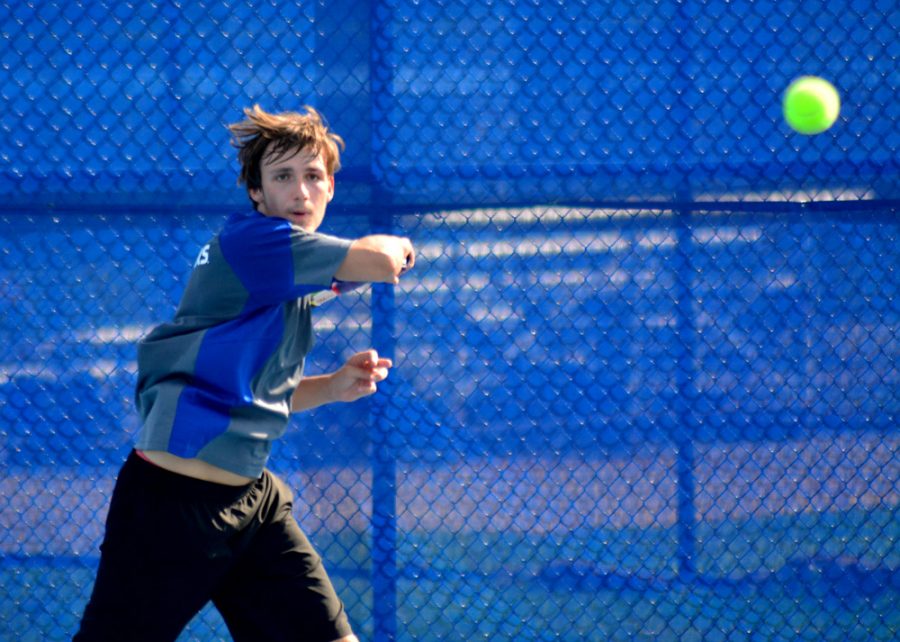 Freshman Marko Stefan Janjusic returns the ball during a preseason practice at Darling Tennis Courts. Janjusic and teammate Braden Davis share the top records for the Panthers at 2-1.