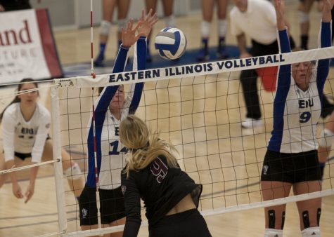 Redshirt freshman Gina Furlin blocks Eastern Kentucky's Nikki Drost's kill attempt Friday. Oct. 14 in Lantz Arena. The Panthers fell 3-2 to the visiting Colonels.