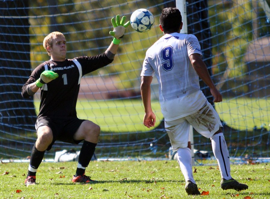 Junior goalkeeper Mike Novotny blocks a shot by Fort Wayne junior midfielder Edel Ensaldo Bustos during the Panthers’ 1-0 win Sunday at the west practice field. Novotny made six saves in the match.