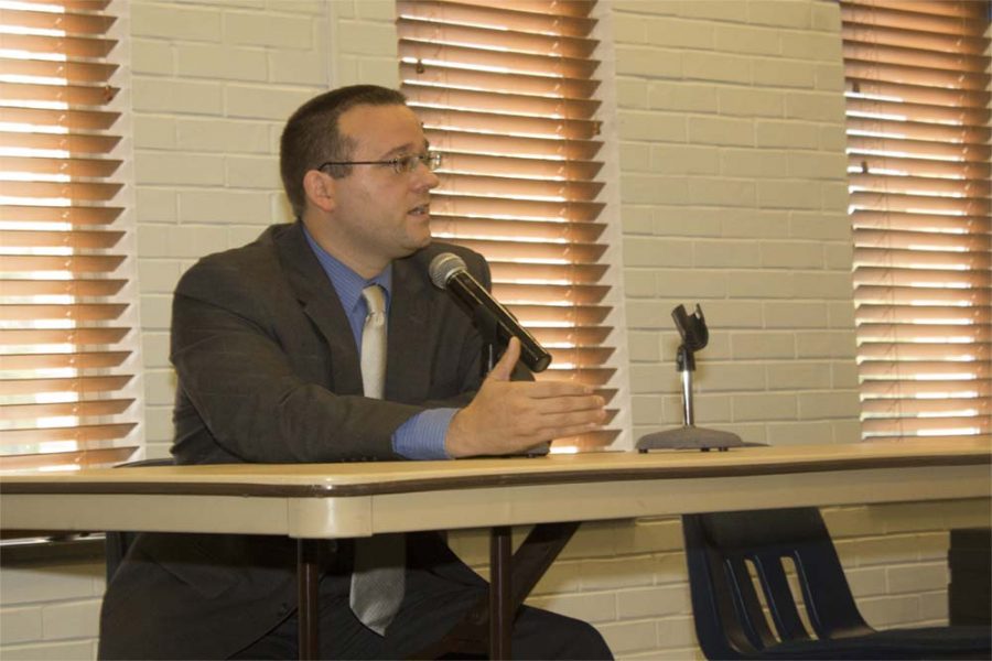 Dennis Malak, Democratic candidate for Illinois’ 110th represenative district, sits next to an empty chair and answers questions from community members during a forum Wednesday at the Martin Luther King Jr. University Union. Reggie Phillips, the incumbent representative, was not in attendance. 