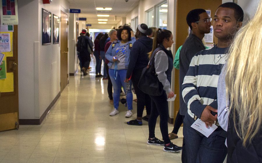 Students stand in line, waiting to register to vote in Coles County Monday in the hallway leading into the Bridge Lounge of the Martin Luther King Jr. University Union.