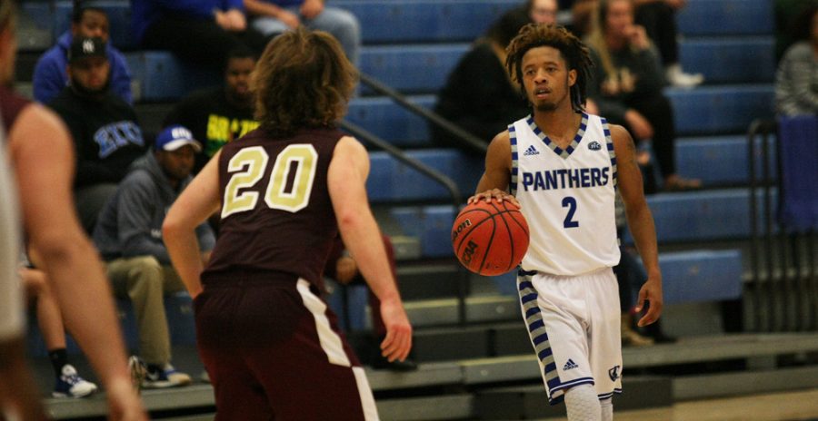 Junior guard Cornell Johnston looks eyes the court for an open teammate Sunday Nov. 6 at Lantz Arena. The Panthers defeated the Red Devils 94-58 in their only exhibition game of the season.