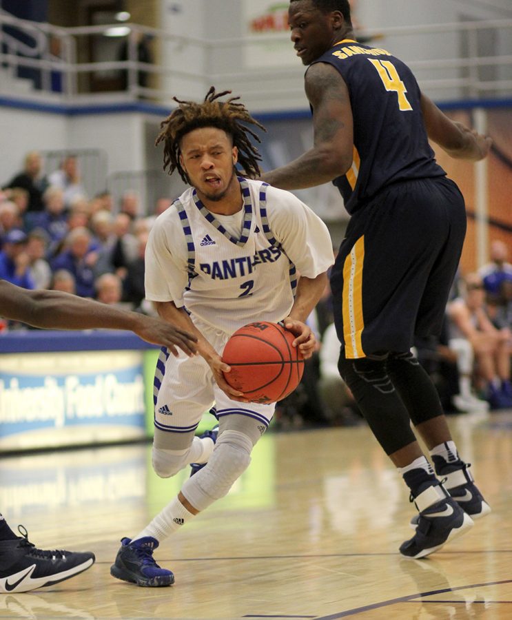 Junior Terrell Lewis drives past two Murray State defenders in the first half on the Panthers’ 83-72 loss to the visiting Murray State Racers.