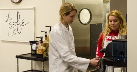Sarah Anderson (left), and Emily Pattison, senior family and consumer sciences majors prepare Lattes before the unveiling of the new furniture in the cafe of Klehm Hall Wednesday afternoon. The furniture was donated by Mike Shelton in memory of his wife, Eastern alumnus, Linda Shelton.