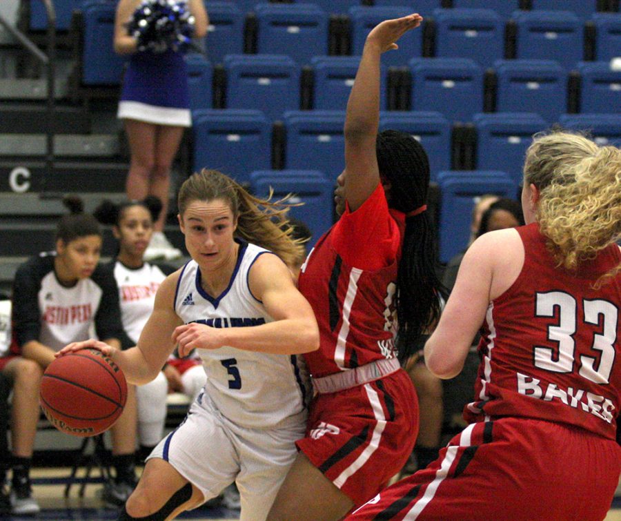 Junior Grace Lennox drives at the basket against an Austin Peay defender Saturday at Lantz Arena. Lennox led all scorers with 22 points in the Panthers’ 69-59 loss to the OVC conference opponent.