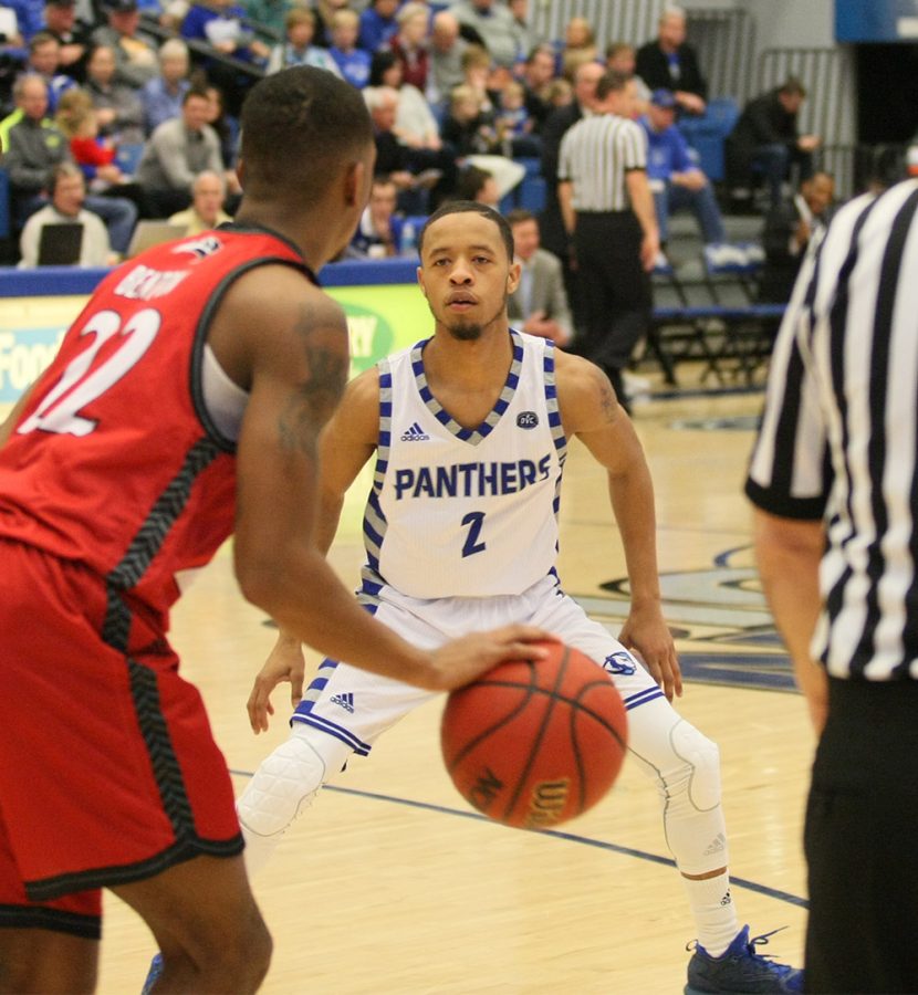 Junior Terrell Lewis tries to defend from SIUE’s Justin Benton Saturday at Lantz Arena. Lewis knocked down 8-of-12 3-pointers for 24 points and panthers 75-60 win.
