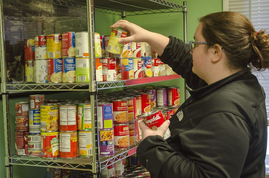Senior Kelly McCleary, dietetics and hospitality major, restocking soup at the Wesley Food Pantry Wednesday in the Wesley Foundation Student Center. The Wesley Food Pantry is open to students, faculty, and staff on the second Wednesday and fourth Tuesday each month, just bring your Panthercard.