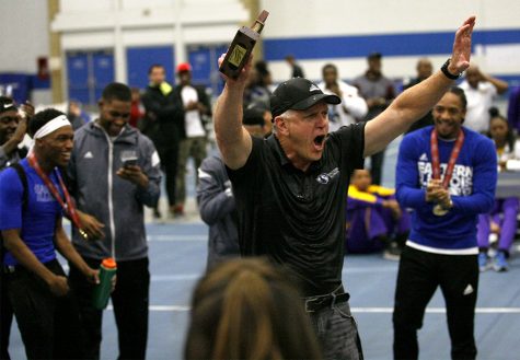 Head coach Tom Akers celebrates after the announcement that both the men’s and women’s track teams both won the OVC championship following Saturday’s final day of the conference meet.