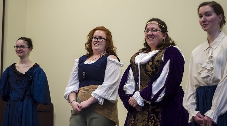 Eastern students dressed in clothing honoring historical women during the Living History Project Premier at the Carneige Library.