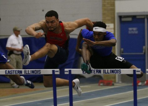 Senior John Piper goes over the hurdles in the 60 yard hurdles. Piper won the race in a time of 8.07 setting a new personal best.