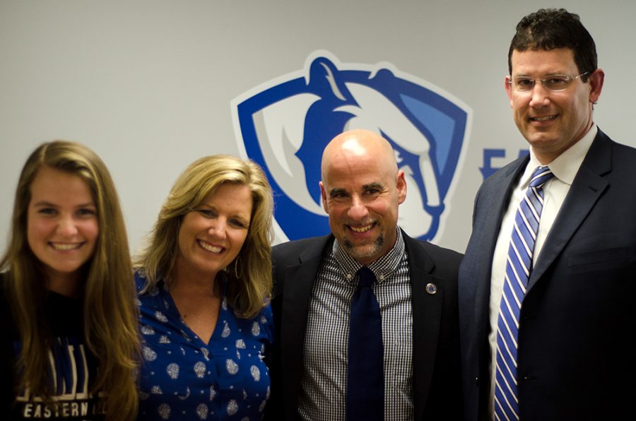 Womens basketball coach Matt Bollant, second from right, Athletic Director Tom Michael and Bollants wife Kari and daughter Regan pose for a photo after Mondays introduction of the new coach.