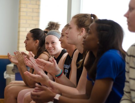 Members of the women's basketball team cheer during the announcement of their new coach Matt Bollant Monday afternoon in Lantz Arena.