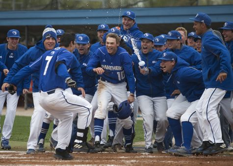 The baseball team celebrates with Hunter Beetley (7) after his walk-off two-run home run in the bottom of the 11th inning during the Panthers' first game of a three-game series against Eastern Kentucky Saturday at Coaches Stadium. The Panthers' won the first game 13-11.