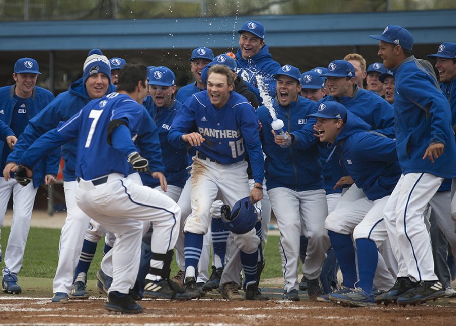 The+baseball+team+celebrates+with+Hunter+Beetley+%287%29+after+his+walk-off+two-run+home+run+in+the+bottom+of+the+11th+inning+during+the+Panthers+first+game+of+a+three-game+series+against+Eastern+Kentucky+Saturday+at+Coaches+Stadium.+The+Panthers+won+the+first+game+13-11.