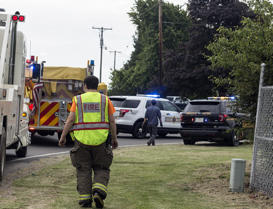 Police cars and fire engines surround the scene of an accident Tuesday afternoon.