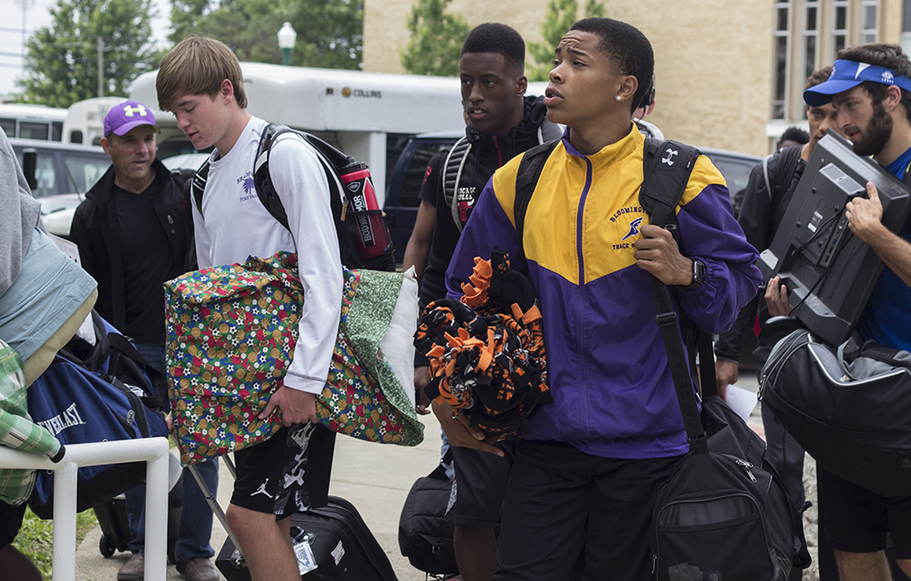 Students from the Bloomington High School track team, file into Taylor Hall Thursday to unload and prepare themselves for the IHSA boys track meet this weekend. Eastern hosts numerous conferences and camps over the summer including the IHSA boys and girls track meets.