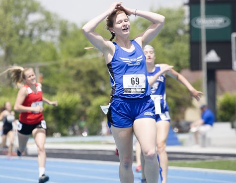 Taylor Larson, a junior from Bushnell High School, competed in class 1A and celebrates after fininishing first in the 400 Meter Dash with a time of 59.75 during thr preliminary round on Thursday. She finished fourth overall in the final round with a time of 58.14.