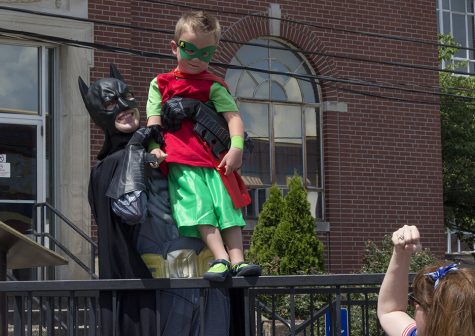 Connor McGranahan, dressed as Batman, holds up Cash McClean, dressed as Robin, Sunday at the Superman Festival in Metropolis.