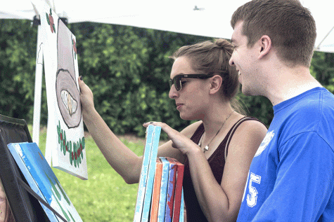 Anna Percivalnn and Brandon Harris celebrate Anna’s birthday by checking out art at Musefest on Saturday.