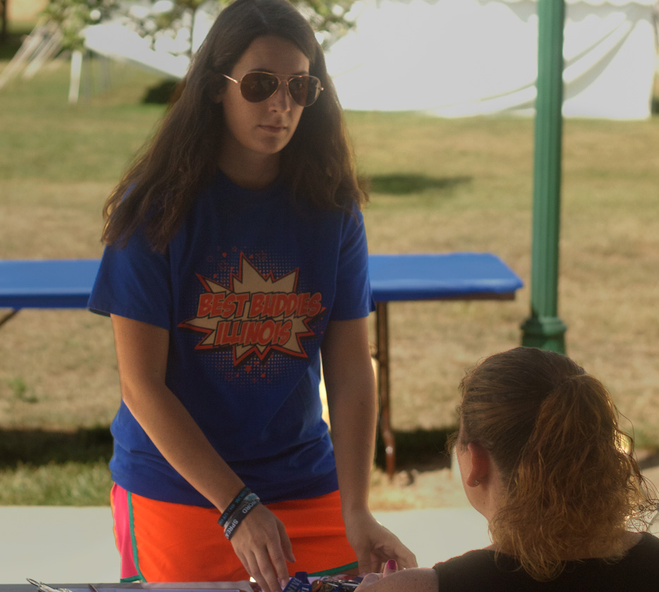 Amber Salutric,a sophmore Speech Pathology and Spanish major, gets information about getting involved in Camp New Hope from a representative of the organization.