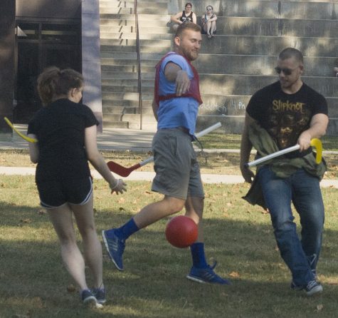 Jack Kwiatkowski, a sports management major and Jacob Hite, who was visiting Eastern for Family Weekend, play Quidditch in the Library Quad Friday afternoon. Kwiatkowski was trying to keep the other two players from getting the ball.