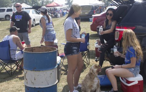 Kellie O’Connor, a sophomore biological sciences major, Melisa Cavka, a sophomore finance major and Hailey Phillips, a freshman pre-nursing major, tailgate outside O’Brien Field Saturday afternoon. The tailgate took place right before the football game between Eastern and Illinois State University. Eastern lost the game with an ending score of 44-13.