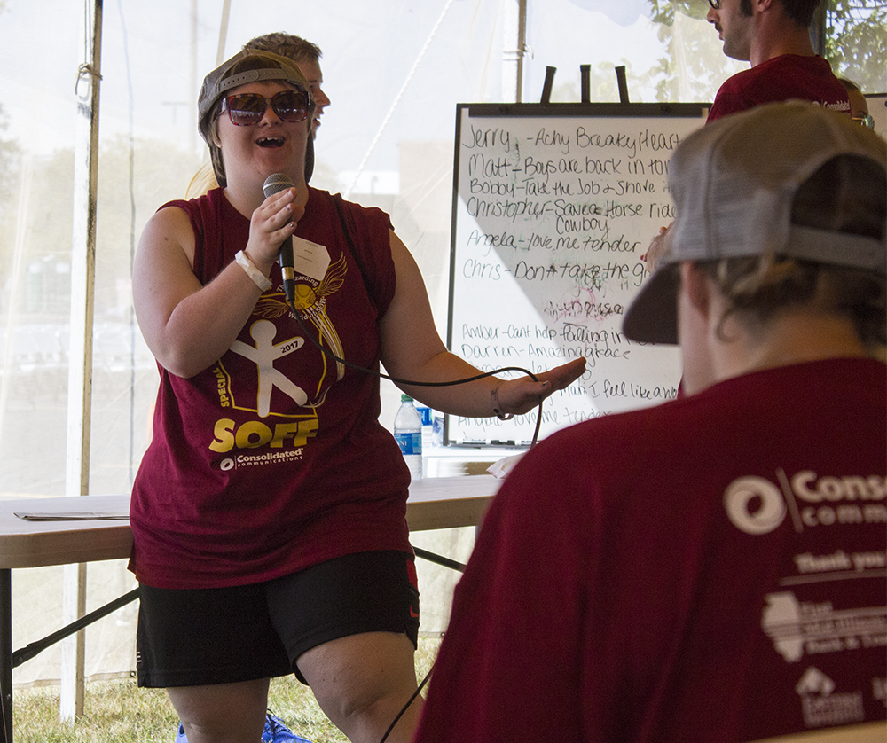 Colleen Moran, a Special Olympics athlete, dances and sings along to Kenny Chesney’s “When the Sun Goes Down,” Saturday during the Special Olympics Family Festival. Moran said she had so much fun getting in front of everyone.