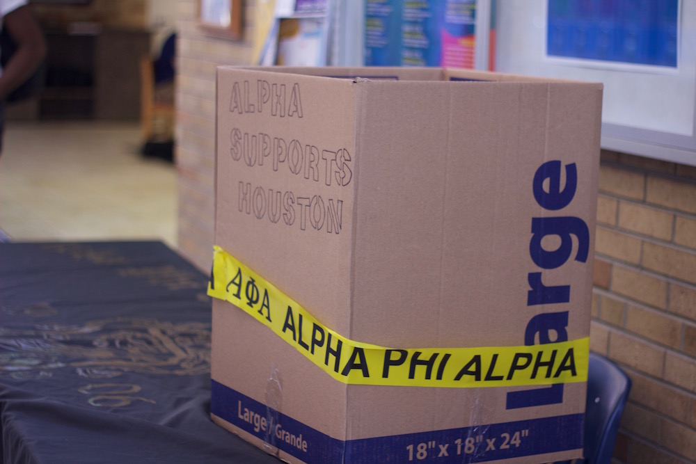 Alpha support Houston is written on the box that sits on Alpha Phi Alpha fraternitys donation table. The fraternity was collecting toiletry items for victims of Hurricane Harvey on Wednesday,  Sept. 20 in the Martin Luther King Jr. University Union.