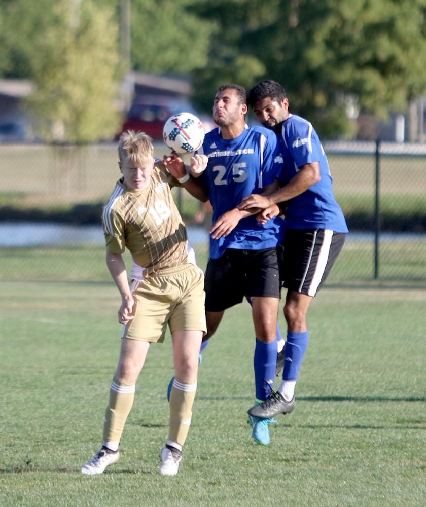 Shady Omar, middle, and Zach Medawattage, right, attempt to knock the ball down on Sunday afternoon at Lakeside Field. The Panthers win 1-0 to improve to 2-0-4 on the season.