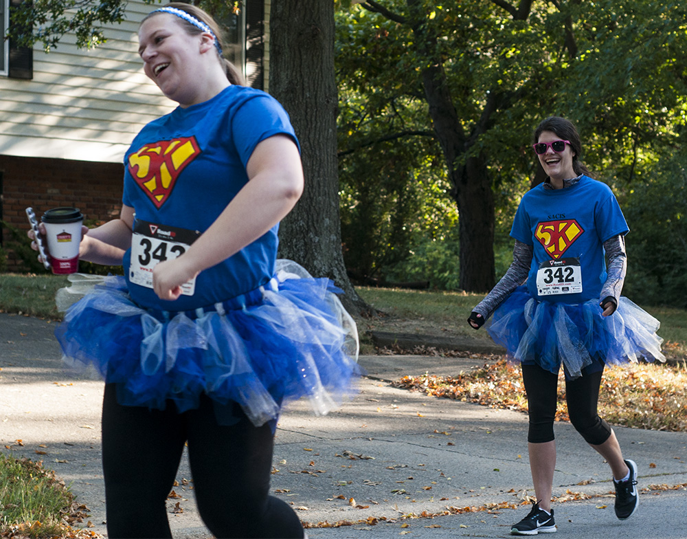 Megan Haley, a graduate student in clinical counseling, dances while her friend Sydney Menigoz, another graduate student in clinical counseling, laughs on Saturday during the SACIS “Take Back the Day” 5k run/walk.