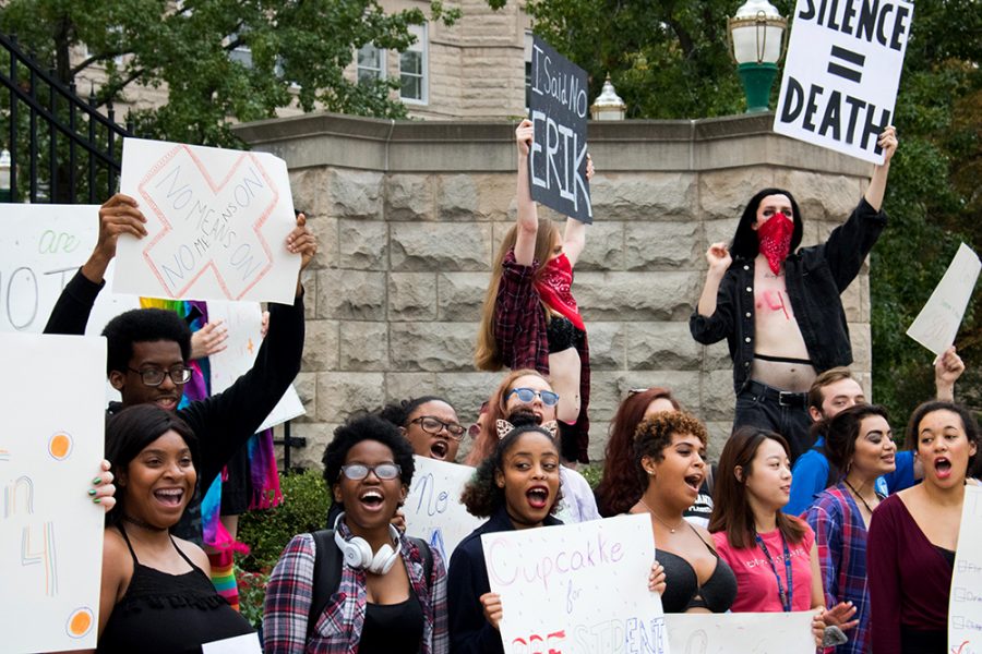 Students stand outside of Old Main at the 5th annual S.L.U.T Walk Wednesday afternoon. President of EIU Pride Siobhan Doherty said, the most empowering thing about this march is, seeing the look on people’s faces as they drive by; and forcing people to acknowledge a problem they don’t see often.