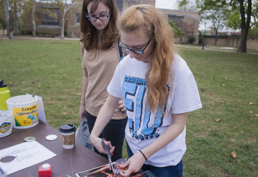 Senior sociology major Lauren Eberle watches as her roomate and Art Association member Clair Gentry creates a button for the first time.
“It’s a really personalized conceot to where you can just walk up and pick a very personalized image,” Gentry said.