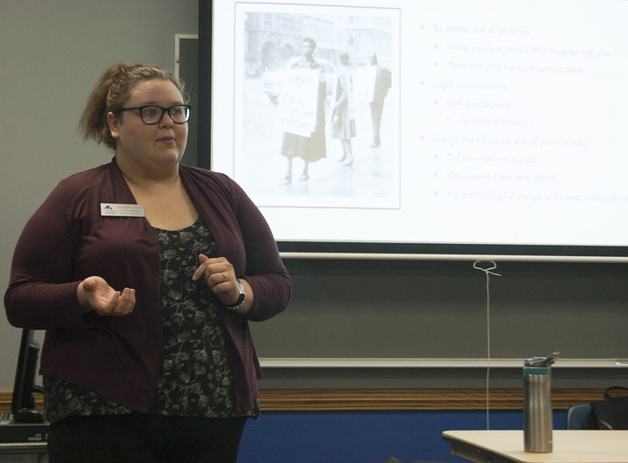 Karissa Light, an intern with the Center for Gender and Sexual Diversity, teaches students how to be an activist for various causes at Activism 101 Wednesday night in the Martinsville Room of the Martin Luther King Jr. University Union.