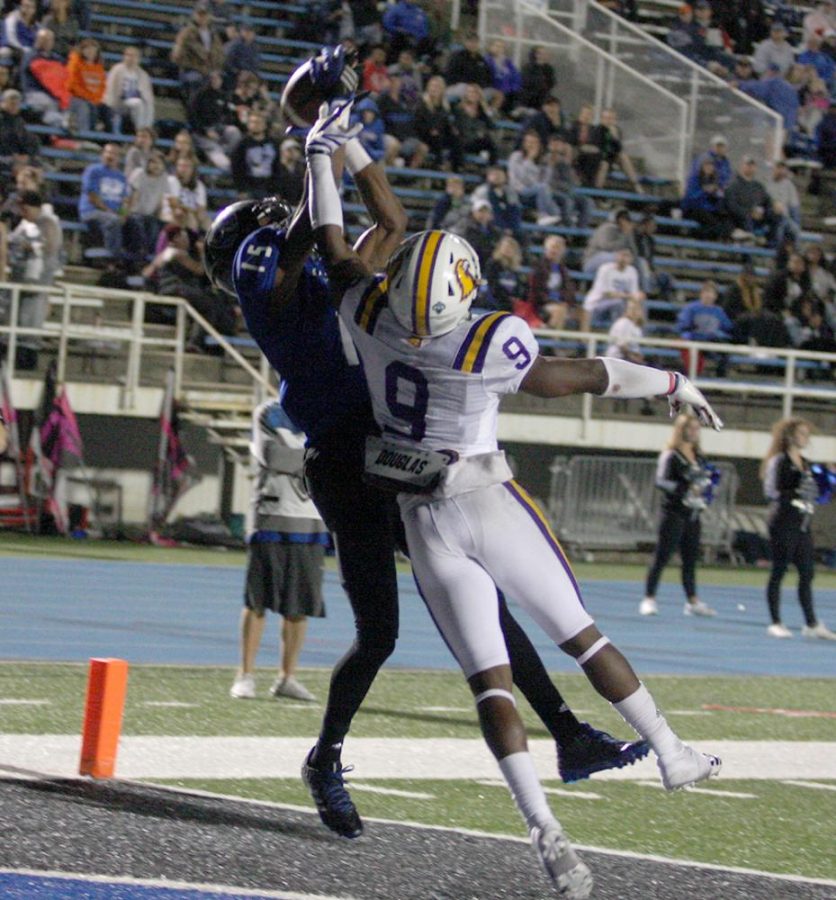 Junior receiver Alexander Hollins goes up and catches the pass from Bud Martin for a touchdown in the Panthers’ 24-23 win. Hollins had three touchdowns.