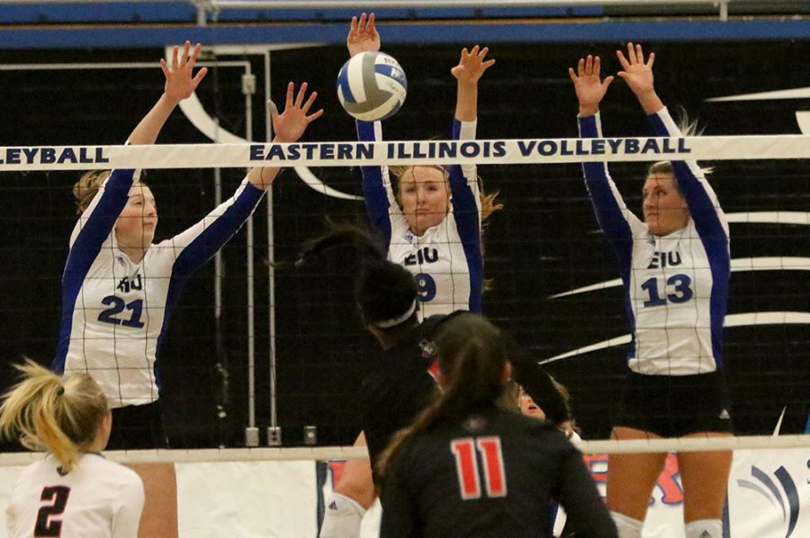 Freshman Lexi May (left), senior Allie Hueston (middle) and senior Maria Brown go up for the block against Austin Peay’s attack. The Panthers lost in straight sets friday in Lantz Arena.