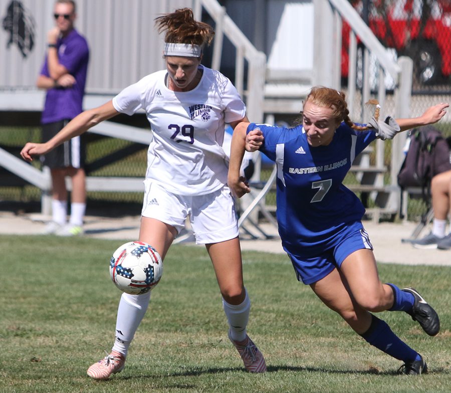 Eastern’s Caitlin hawley fights for a ball with Western Illinois’ Alexandra Siavelis in a game on Sep. 10. The Panthers won the game at Lakeside Field 2-1.