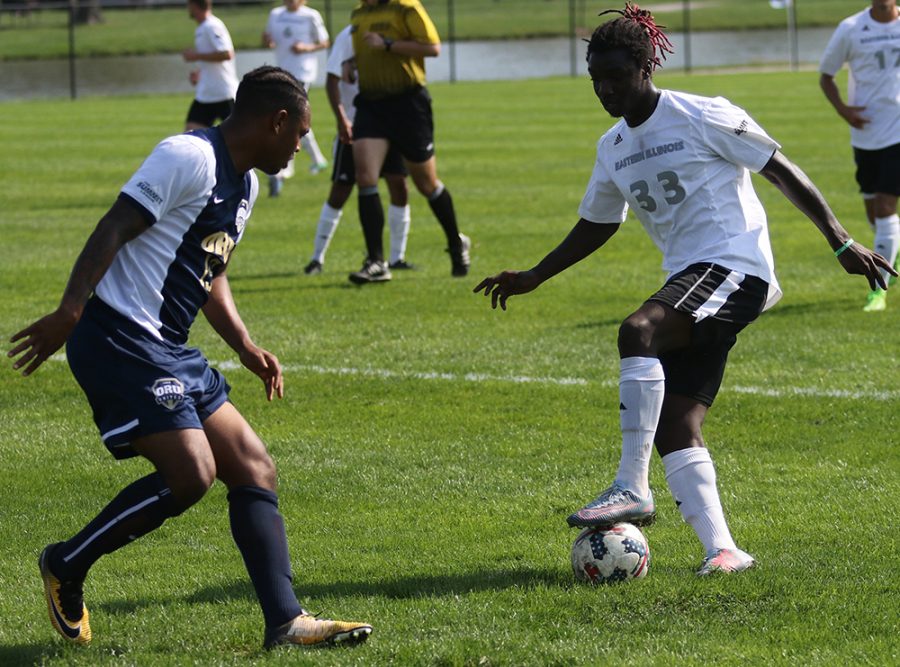 Eastern freshman Simeon Packer dribbles a ball around an Oral Roberts defender in the Panthers game against them on Oct. 14. Eastern won the game 1-0 at Lakeside Field.
