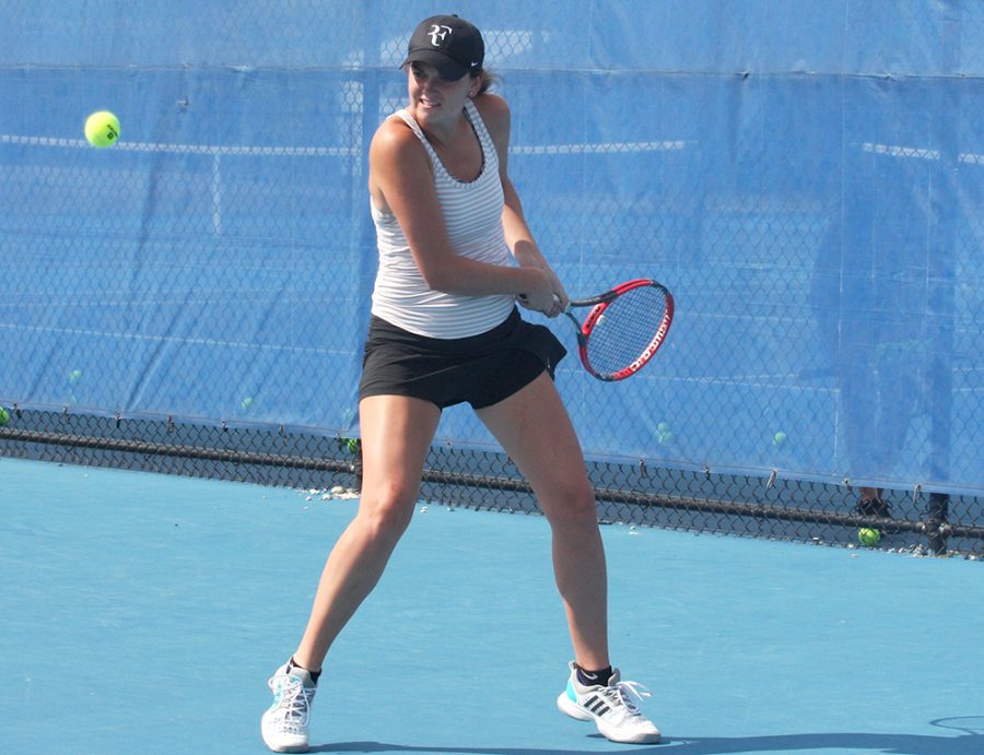 Junior Abby Carpenter backhands a ball back to sophomore Emily Pugachevsky in practice at the Darling Courts Sept. 21. The Panthers are in their offseason getting ready for the spring season.