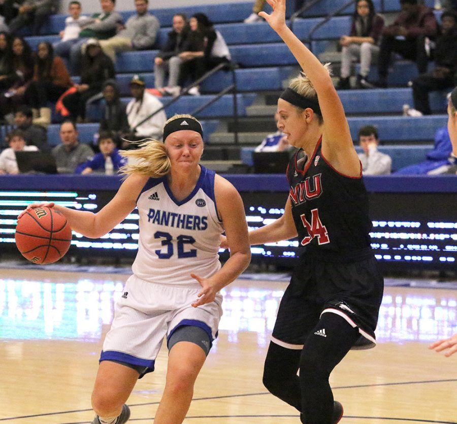 Eastern foward Jennifer Nehls drives the basket in a game against Northern Illinois at Lantz Arena Nov. 10. Nehls scored eight points and snagged four rbounds in the Panthers season-opening loss.
