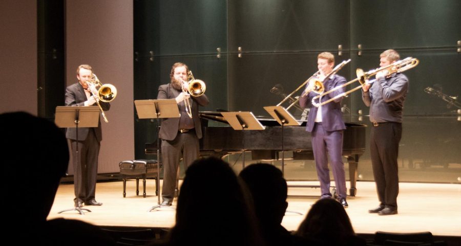 Jacob Hardy a music performance major (left), Eric Dawson (middle left) a music major and music proffesor Jemmie Robertson (right) perform with Peter Steiner Tuesday night in the recital hall at the Doudna Fine Arts Center.