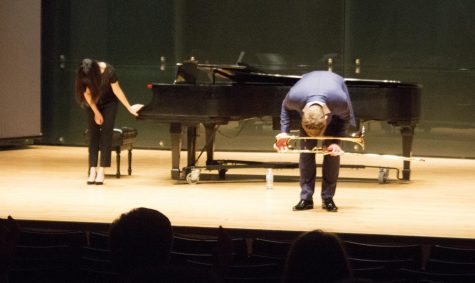 Collaborative Pianist Dr.Kevina Lam and Peter Steiner bow after their performance in the recital hall Tuesday night at the Doudna Fine Arts Center.