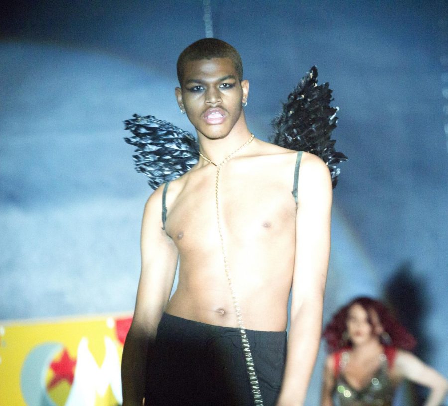 Cassie Buchman | The Daily Eastern News Couture model Asante Willis, a junior computer information technology major, walks down the runway during the Couture Models’ fashion show Saturday night.