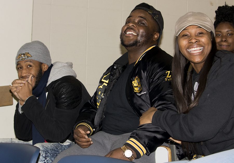 Kaleb Williams a senior kinesiology major, Elijah Weathers a senior Africana studies major and Deearia Watkins a junior family consumer sciences major, laugh with each other at “Black Jeopardy” Tuesday night at Coleman hall.