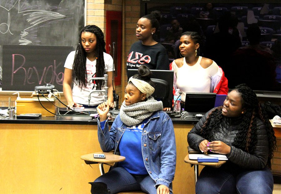 Olivia Swenson-Hultz | The Daily Eastern News Students participate in African American culture, music, hisory and film based trivia questions at “Proud Family: Black By Popular Demand” inside of Phibbs Lecture Hall in The Physical Science Building on Wednesday evening.