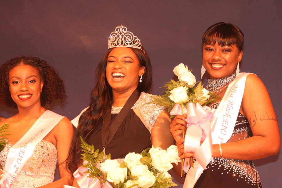 Maxie Phillips (left), a junior English major and the second runner-up for Miss Black EIU, Raven Gant (middle), a junior biological sciences major and winner of Miss Black EIU and Rajah Matthews (right), a sophomore kinesiology and sports studies major and the first runner-up for Miss Black EIU, pose after Gant was crowned Saturday night in the Grand Ballroom of the Martin Luther King Jr. University Union. After being crowned Miss Black EIU, Gant said she surprised herself with what she was able to accomplish. “Me and all my sisters, we worked very hard. We stuck together through the entire process,” she said. “I’m happy for each and every one of these girls, I know we all put in the effort. It’s just a great experience.”