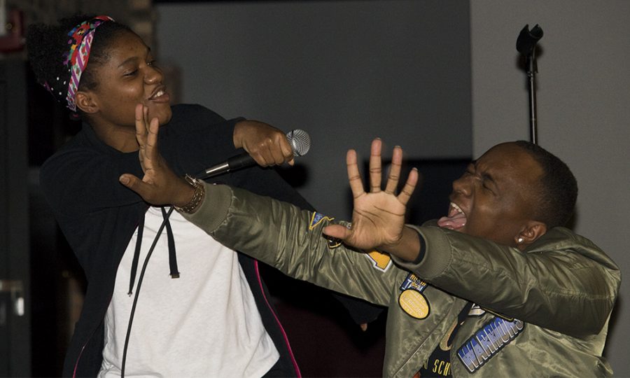Jordan Boyer | The Daily Eastern News
Astoria Griggs- Burns a senior health administration major, and Parrish Amos a junior English major, sing on stage at “Ladies and Hip-Hop” Monday night at the 7th Street Underground.