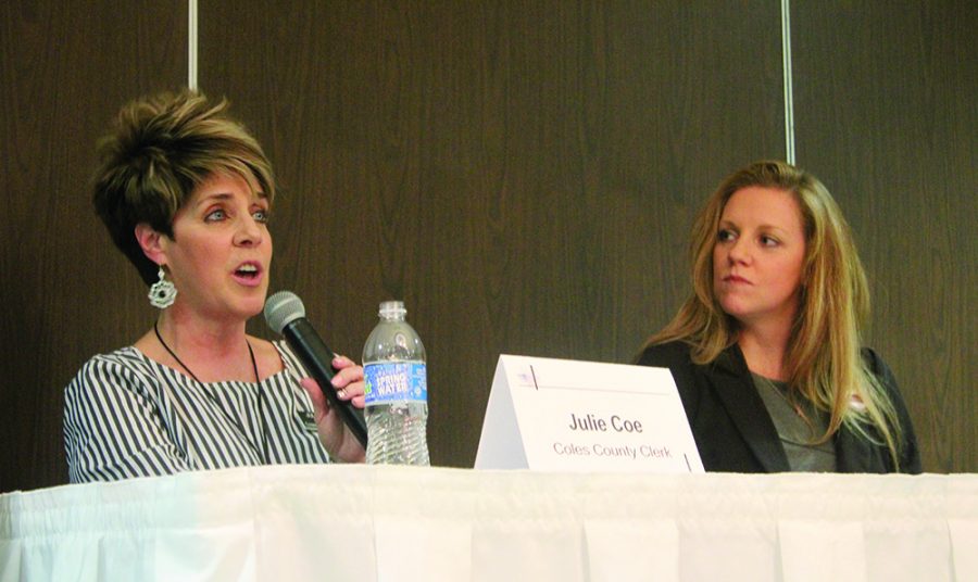 Coles County Clerk candidates Julie Coe and Jackie Freezeland answer questions regarding their campaigns Tuesday evening at the Unique Suites Hotel.