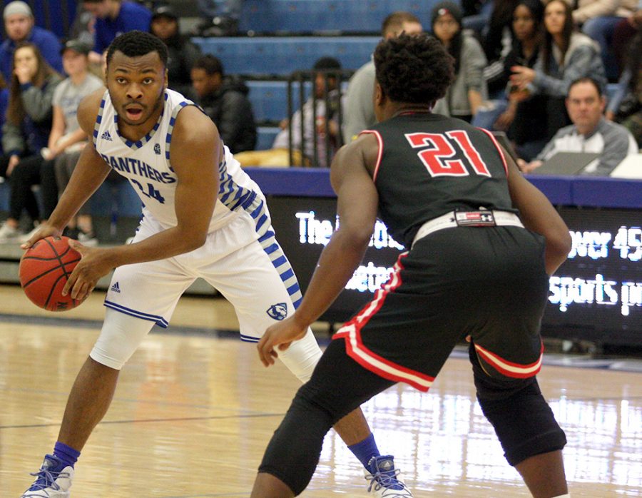 Junior Jajuan Starks handles the ball at the top of the arc in the Panthers’ 76-69 loss to Austin Peay Saturday in Lantz Arena. Starks scored six points in the game.